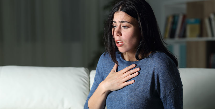 woman-suffering-anxiety-attack-alone-night